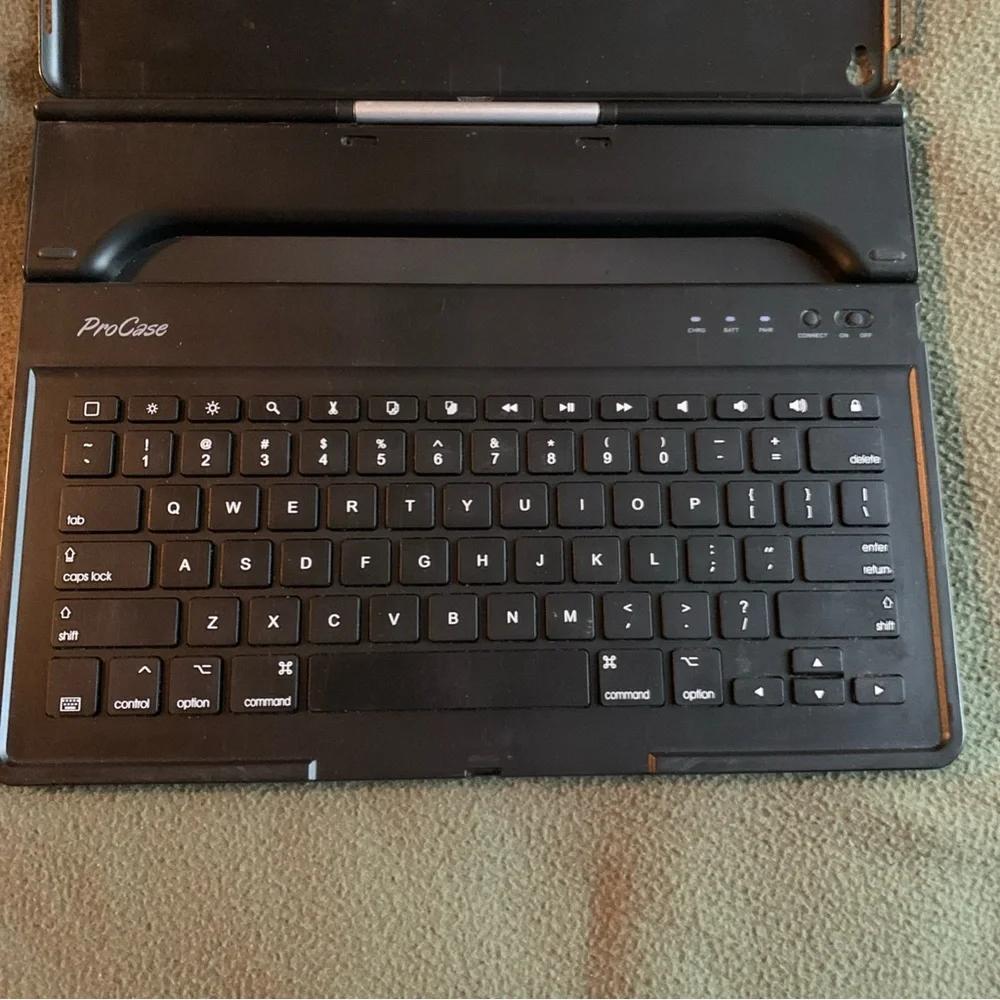 FUC ProCase keyboard case for iPad Pro 12.9”. Black and silver. Charging cord.